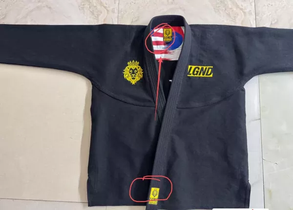 Hur balanserar Pandawin Sports anpassade BJJ gis den hållbarhet som krävs för intensiv kamp med personliga varumärkesbehov?